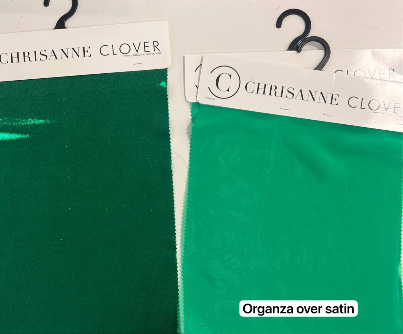 Green metallic and sheer fabric swatches selected for Aurora