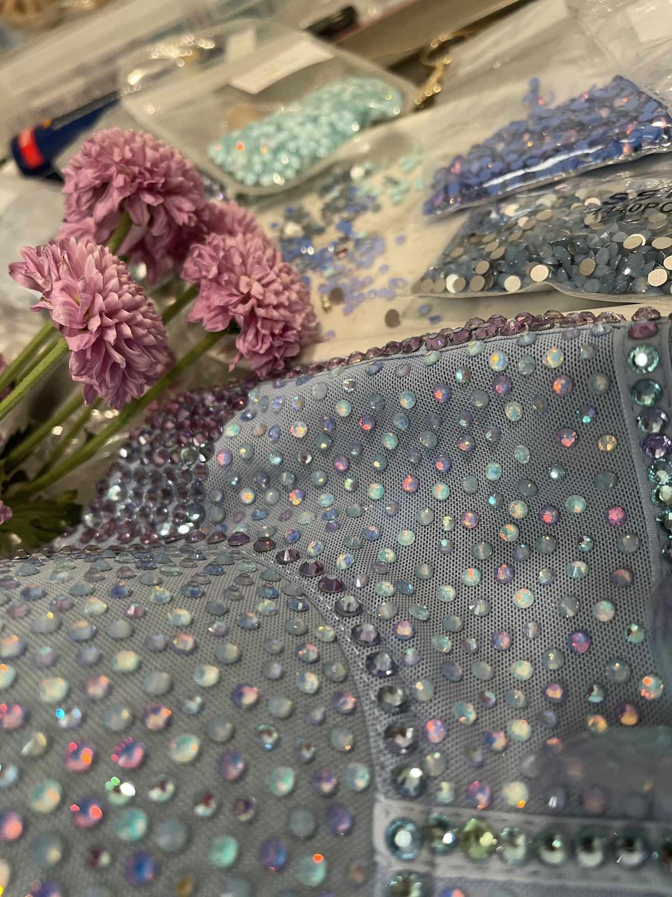 Blue Mirage crystals, flowers and embellished bodice during construction