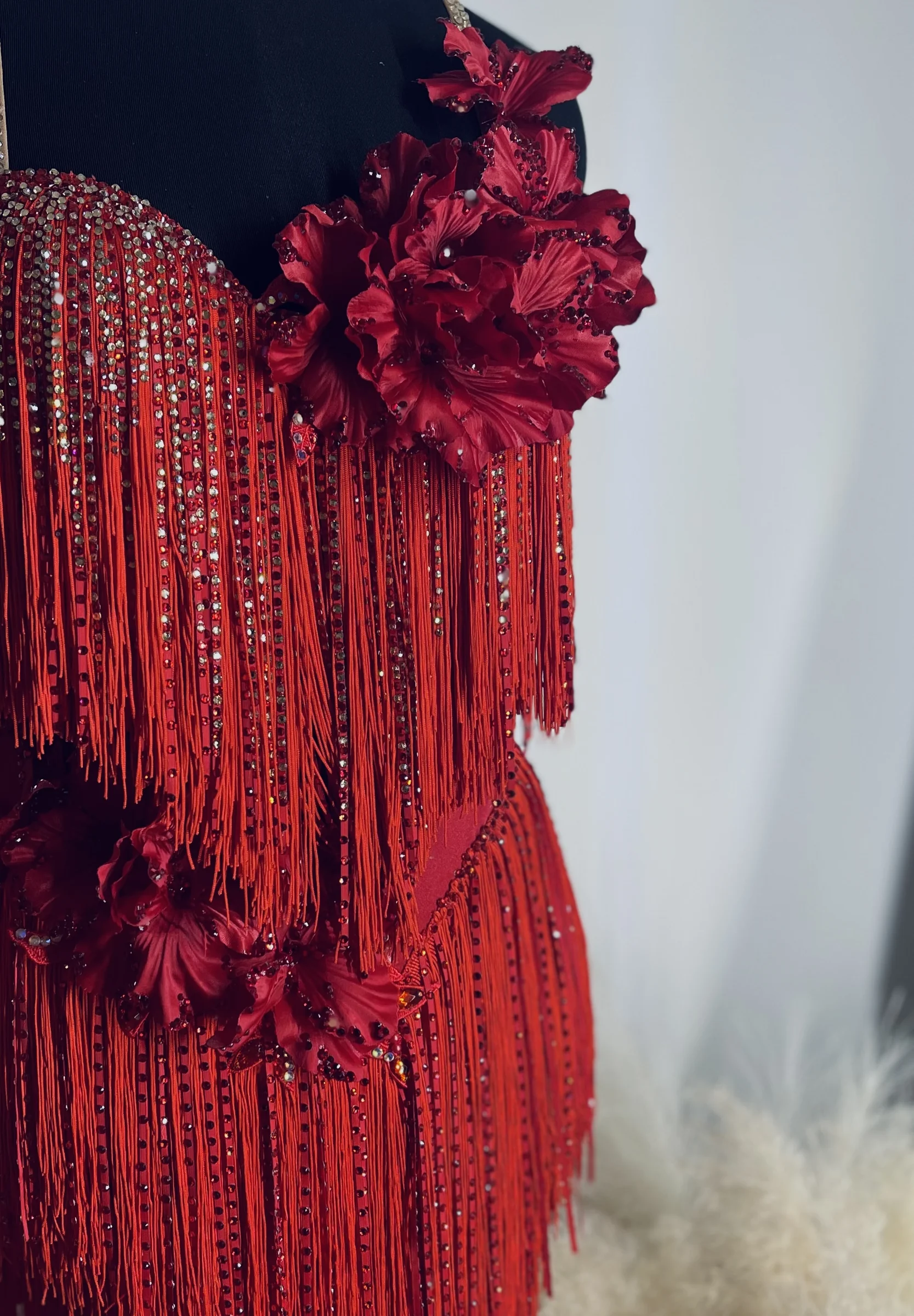 Red couture gown with fringe, flowers and rhinestones