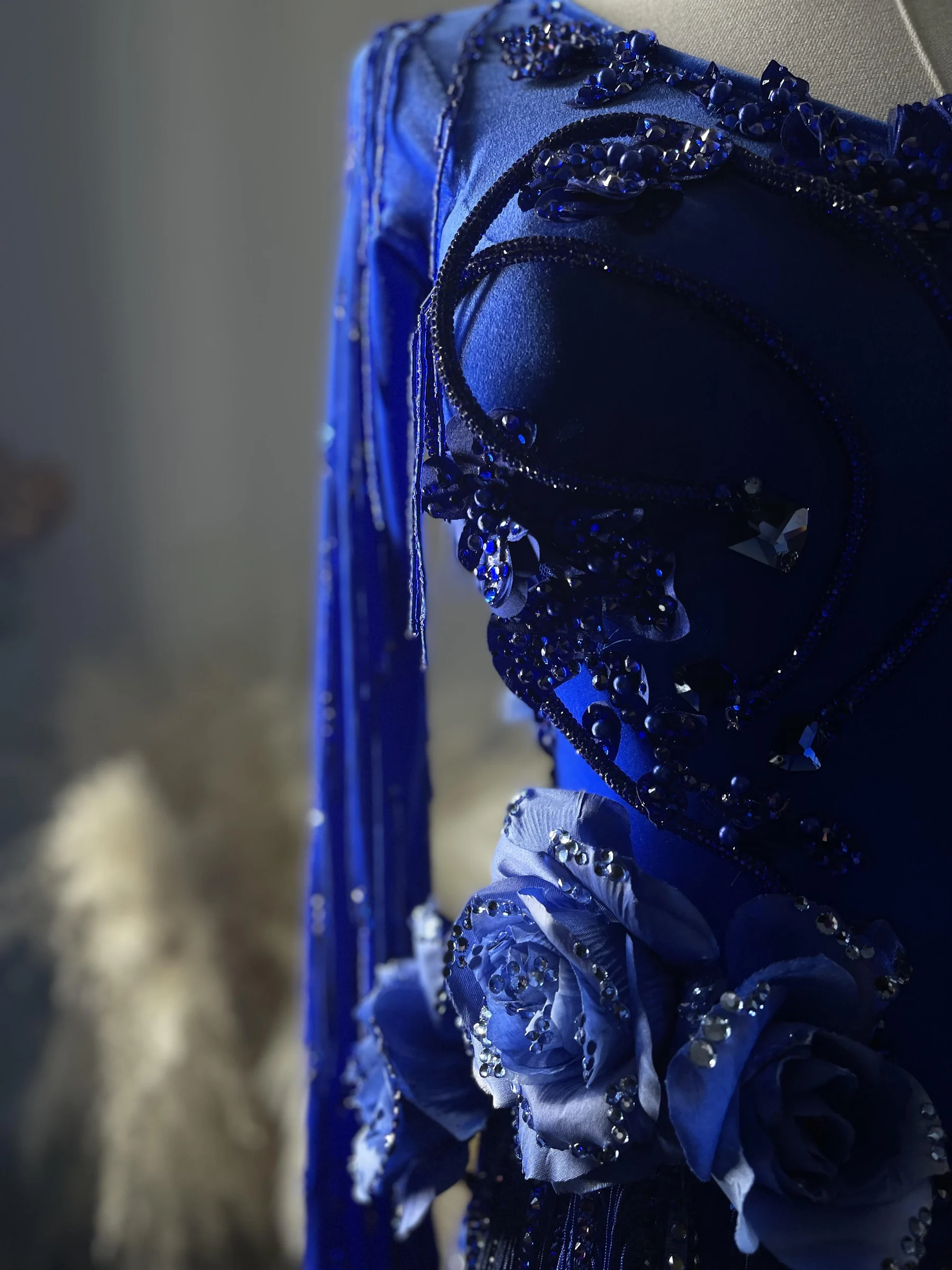 Blue couture gown with floral and crystal details